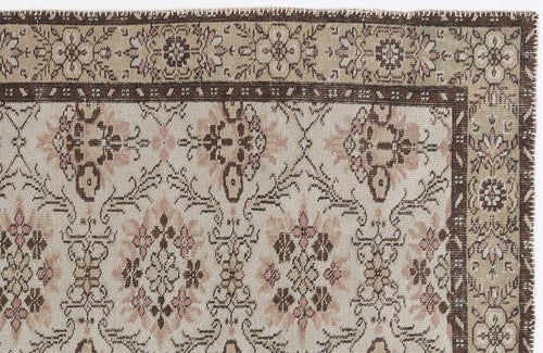 Load image 1 in gallery view. Beige, brown, and muted pink traditional rug with a floral medallion pattern and a wide decorative border.