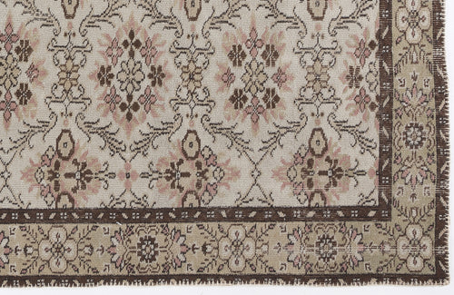 Load image 1 in gallery view. Cream, brown, and dusty pink rug with a traditional floral medallion pattern and a wide decorative border.