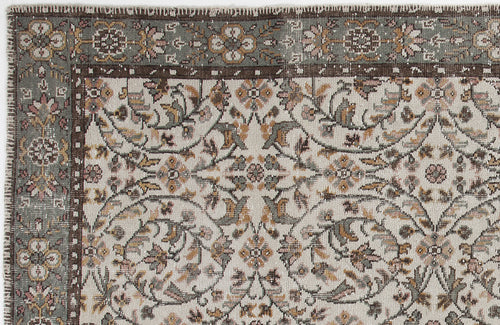 Load image 1 in gallery view. Cream, sage green, and brown traditional rug with a floral vine pattern and a decorative border.