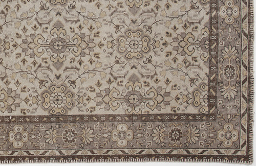 Load image 1 in gallery view. Beige and brown traditional rug with a distressed floral medallion pattern and a detailed geometric border.