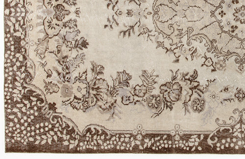Load image 1 in gallery view. Beige and brown rug with a distressed floral medallion pattern and a detailed botanical border.