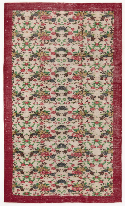 Load image 1 in gallery view. Cream rug with a repeating floral pattern in red, green, and black, featuring a wide solid red border.