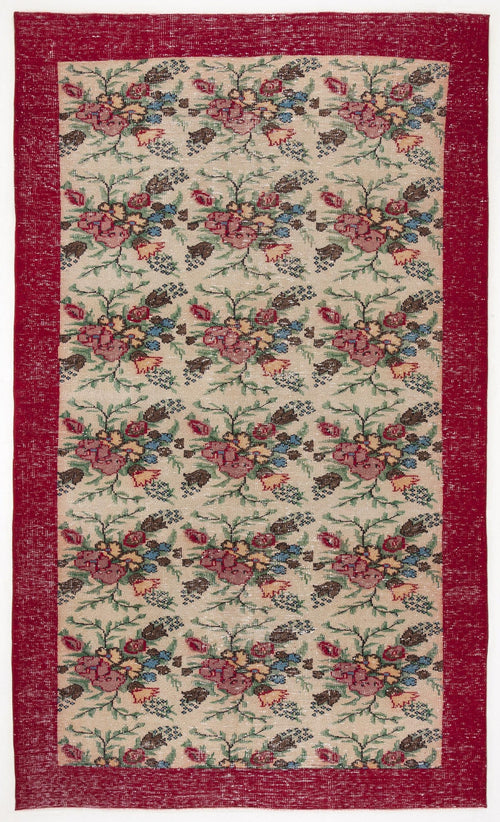 Load image 1 in gallery view. Beige rug with a repeating floral pattern in red, blue, and green, framed by a solid red border.
