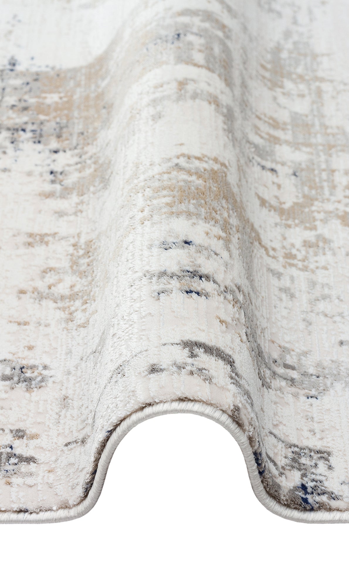Cream, beige, and grey rug with a distressed abstract pattern, shown folded on a white background.
