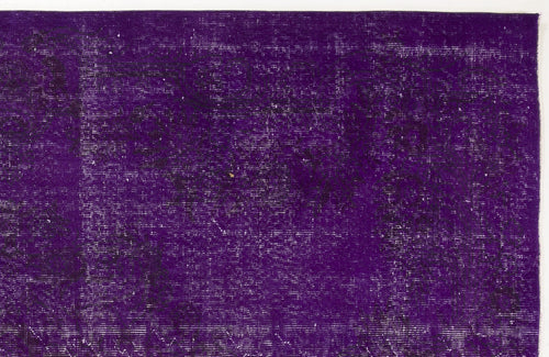 Load image 1 in gallery view. Deep purple distressed overdyed rug with a faint, traditional floral medallion pattern.