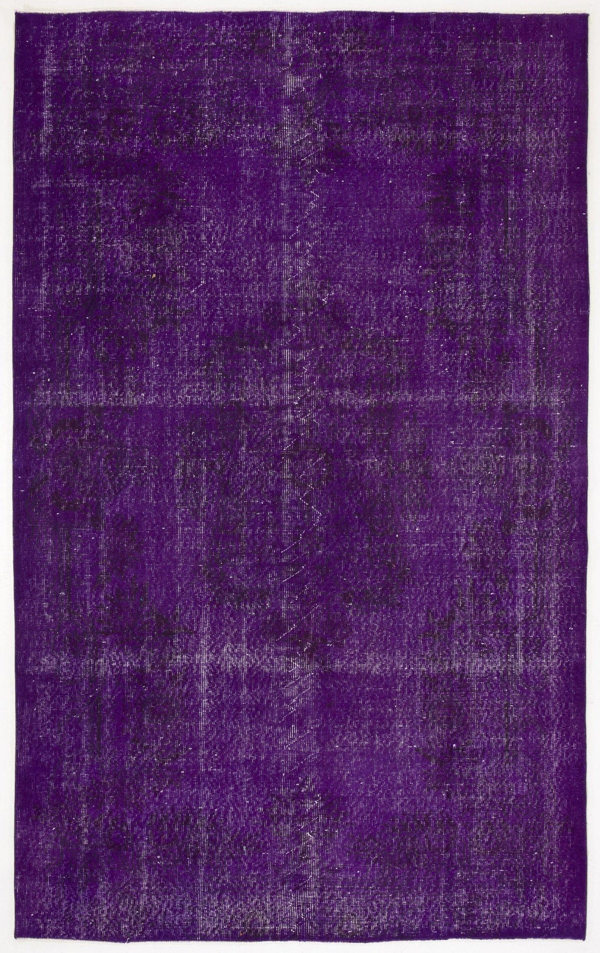 Deep purple vintage-style rug with a distressed, faded texture and subtle, worn-out traditional pattern.