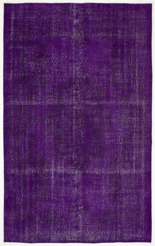 Load image 1 in gallery view. Deep purple vintage-style rug with a distressed, faded texture and subtle, worn-out traditional pattern.