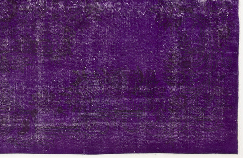 Load image 1 in gallery view. Deep purple vintage-style rug with a distressed, faded traditional floral pattern.