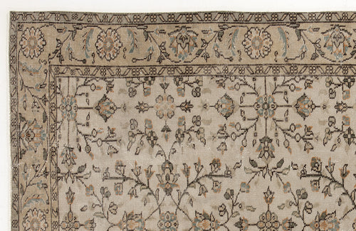 Load image 1 in gallery view. Beige traditional rug with a distressed floral vine pattern in muted blue, grey, and orange accents.