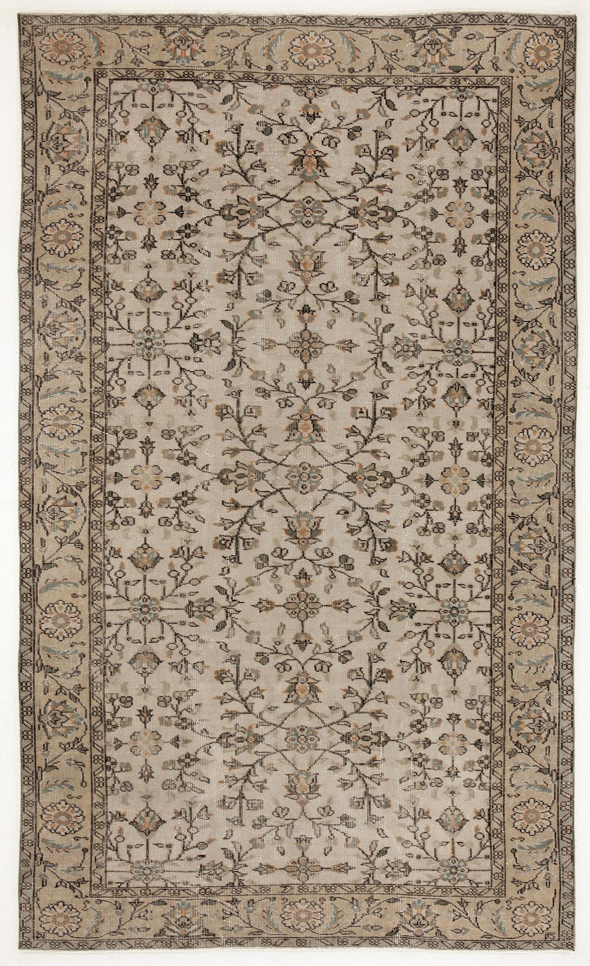 Beige traditional rug with a symmetrical floral vine pattern, muted blue and orange accents, and a decorative border.