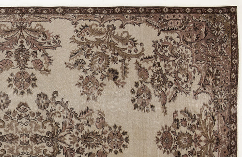 Load image 1 in gallery view. Beige and brown traditional rug with a distressed floral medallion pattern and a detailed border.