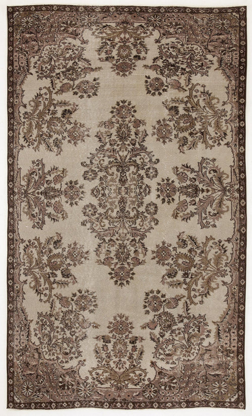 Load image 1 in gallery view. Beige and brown vintage-style rug with a central floral medallion and ornate botanical border.