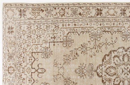 Load image 1 in gallery view. Beige and brown rug with a distressed traditional floral medallion pattern and geometric border.