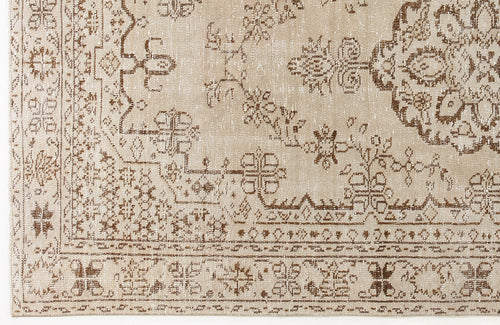 Load image 1 in gallery view. Beige and brown rug with a distressed traditional medallion and floral border pattern.