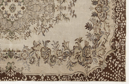 Load image 1 in gallery view. Beige and brown vintage-style rug with a distressed floral medallion pattern and a dark brown decorative border.
