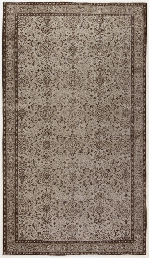 Load image 1 in gallery view. Taupe and dark brown traditional rug with a distressed floral medallion pattern and a geometric border.