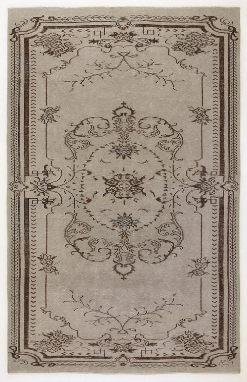 Load image 1 in gallery view. Taupe and dark brown area rug featuring a central floral medallion and ornate border on a white background.