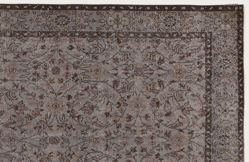 Load image 1 in gallery view. Grey and brown traditional rug with a distressed floral medallion pattern and a dark border.
