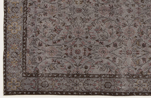 Load image 1 in gallery view. Grey and brown vintage-style rug with a distressed floral medallion pattern and a detailed border.