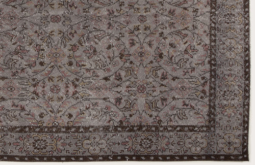 Load image 1 in gallery view. Grey and brown distressed rug with a traditional floral medallion pattern and a detailed border.