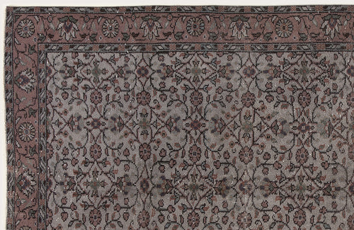 Load image 1 in gallery view. Muted mauve and grey traditional rug with a dense floral vine pattern and a decorative border.