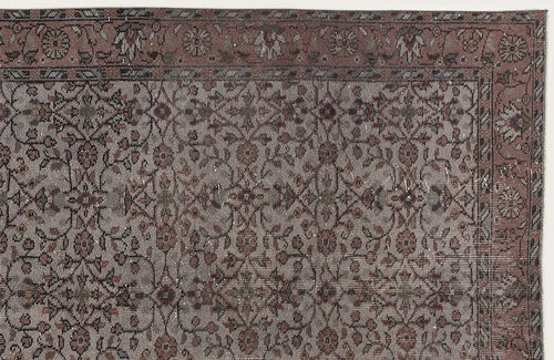 Load image 1 in gallery view. Muted mauve and grey traditional rug with a distressed floral vine pattern and a decorative border.