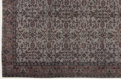 Load image 1 in gallery view. Grey and mauve traditional rug with a repeating floral vine pattern and a decorative border.