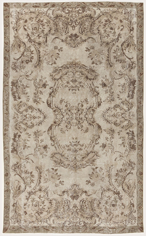 Load image 1 in gallery view. Beige and brown vintage-style rug with a distressed floral medallion pattern and a decorative border.