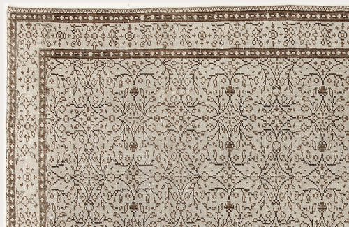 Load image 1 in gallery view. Beige and brown rug with a traditional floral medallion pattern and a detailed geometric border.