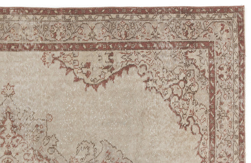 Load image 1 in gallery view. Beige and terracotta distressed rug with a traditional floral medallion border and central motif.
