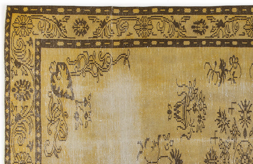 Load image 1 in gallery view. Mustard yellow and dark brown vintage-style rug with a distressed floral border and central medallion pattern.