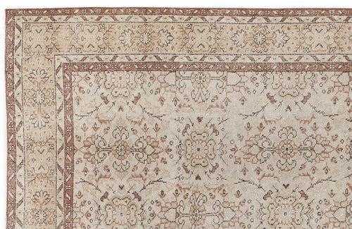 Load image 1 in gallery view. Beige and terracotta traditional rug with a distressed floral medallion pattern and a geometric border.