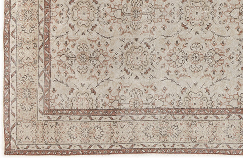 Load image 1 in gallery view. Beige and terracotta distressed rug with a traditional floral medallion pattern and a geometric border.