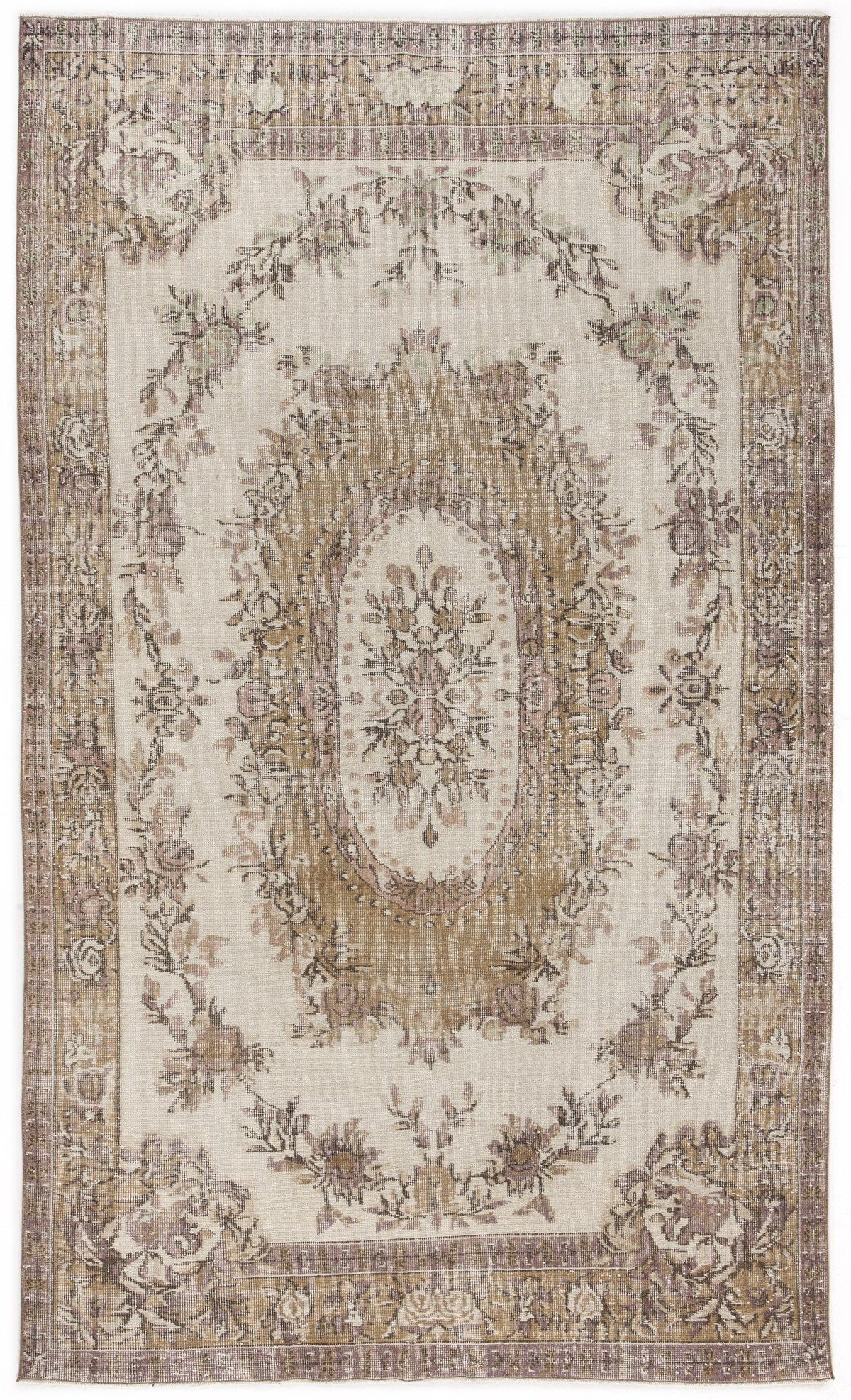 Beige and mauve vintage-style rug with a central floral medallion and a decorative botanical border.
