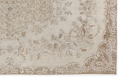 Load image 1 in gallery view. Beige and taupe rug with a distressed traditional floral medallion pattern and a decorative border.