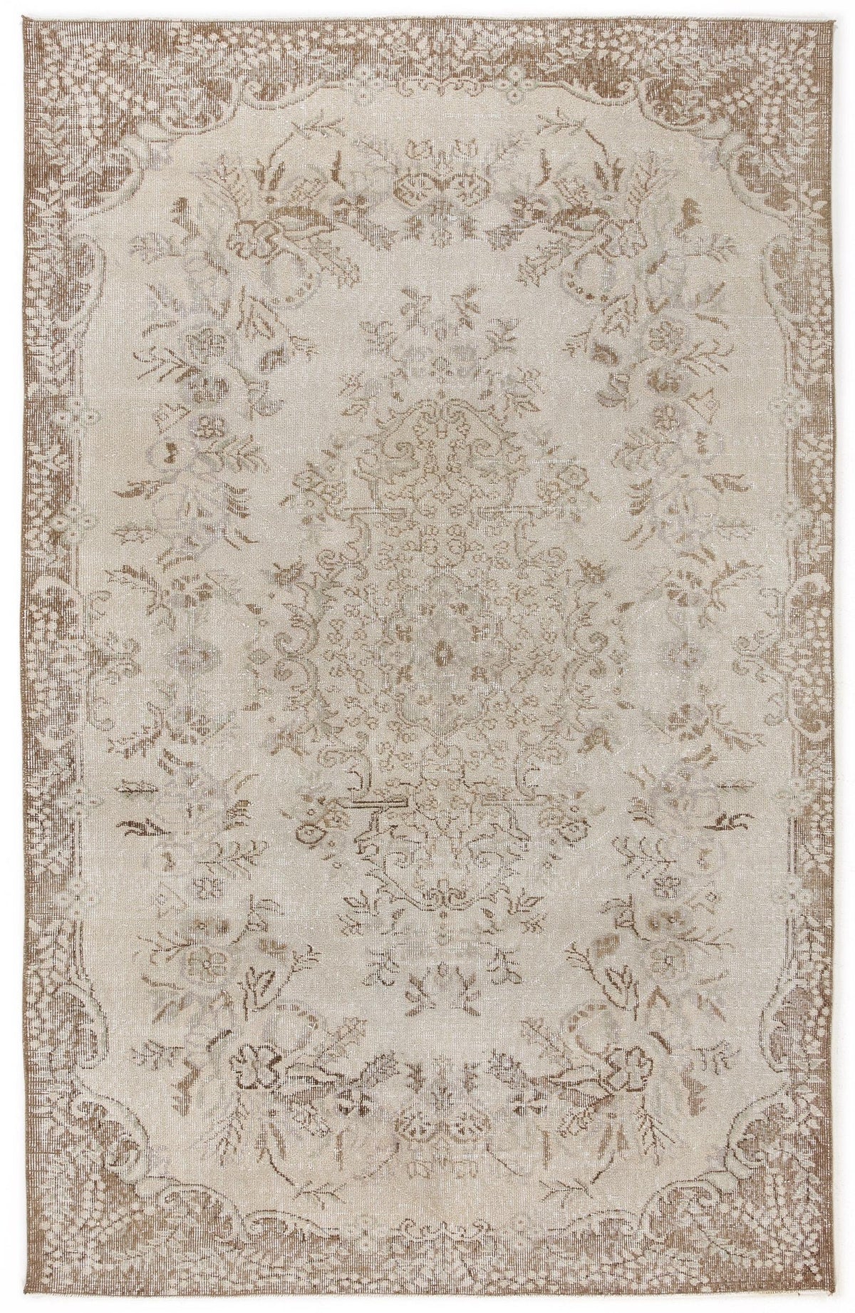 Beige and taupe traditional rug with a distressed floral medallion pattern and an ornate border.