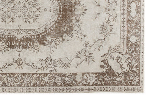 Load image 1 in gallery view. Taupe and cream traditional rug with a distressed floral medallion pattern and ornate border.