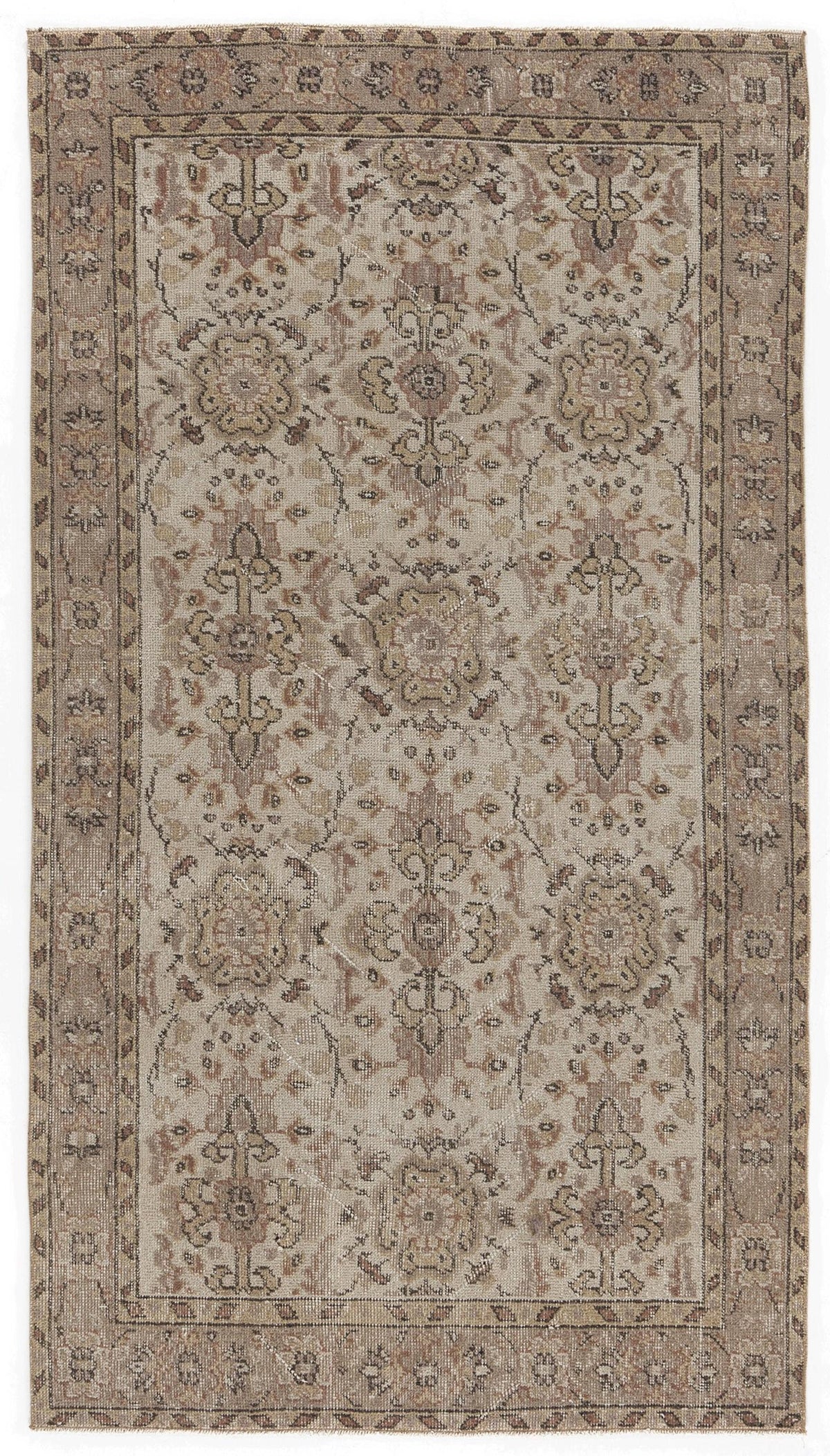 Beige and brown vintage-style rug with a distressed floral medallion pattern and a geometric border.