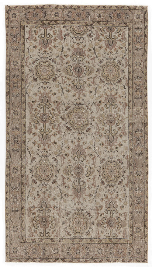 Load image 1 in gallery view. Beige and brown vintage-style rug with a distressed floral medallion pattern and a geometric border.