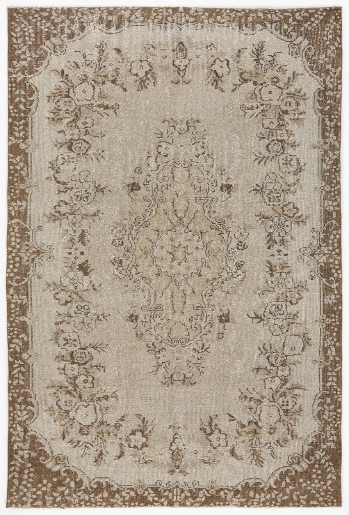 Beige and brown vintage-style rug with a central floral medallion and a decorative floral border.