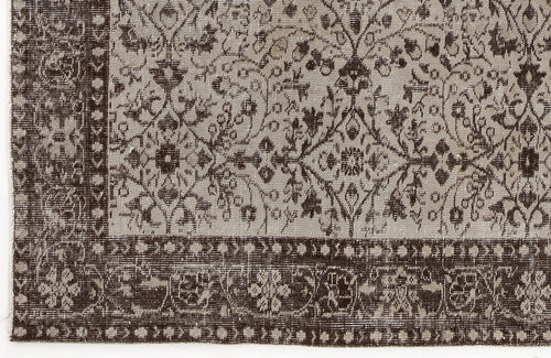 Load image 1 in gallery view. Dark brown and light gray rug with a traditional floral medallion pattern and a detailed geometric border.