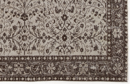 Load image 1 in gallery view. Dark brown and beige rug with a traditional floral medallion pattern and a decorative border.
