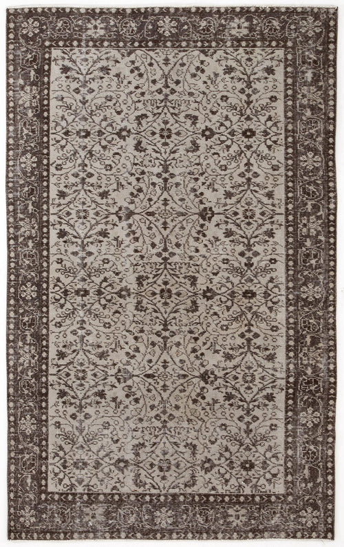 Load image 1 in gallery view. Dark brown and beige vintage-style rug with a distressed floral medallion pattern and a wide decorative border.