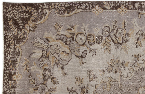 Load image 1 in gallery view. Distressed grey and brown traditional rug with a faded floral medallion pattern and ornate border.