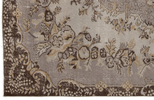 Load image 1 in gallery view. Distressed grey and brown rug with a traditional floral medallion pattern and ornate border.