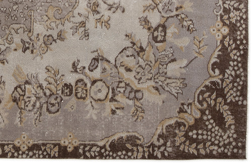 Load image 1 in gallery view. Grey and brown distressed rug with a traditional floral medallion pattern and a dark border.