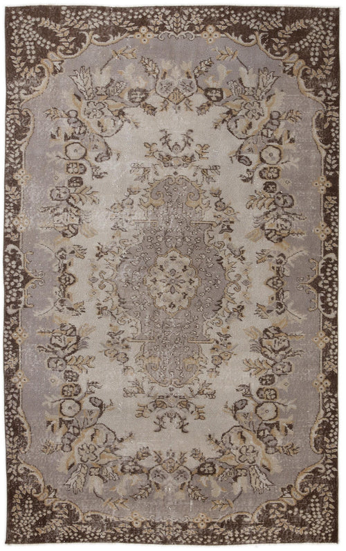 Load image 1 in gallery view. Distressed grey and brown traditional rug with a central floral medallion and ornate border pattern.