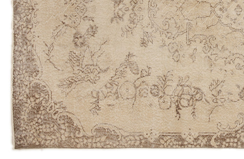 Load image 1 in gallery view. Beige and brown rug with a distressed floral medallion pattern and a decorative border.