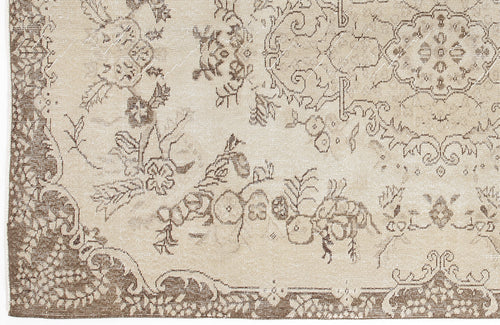 Load image 1 in gallery view. Beige and brown rug with a distressed traditional floral medallion pattern.