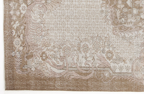 Load image 1 in gallery view. Taupe and cream rug with a distressed floral medallion pattern and a central diamond lattice motif.